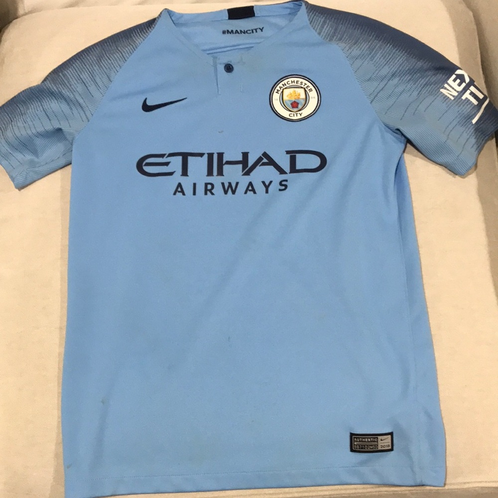 Manchester City button up kids jersey.   Great.